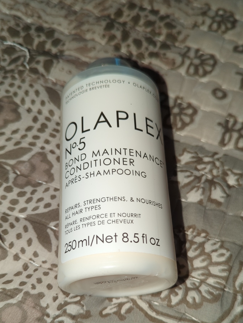 OLAPLEX No.5 Bond Maintenance Conditioner — White bottle with black text